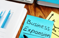 Note with business expansion on it.